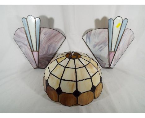 A pair of Tiffany style wall lights and a Tiffany style lamp shade