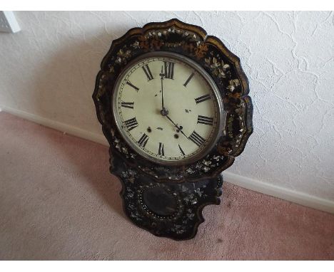A mid-19th century drop dial wall clock in an ebonised finish, applied mother of pearl and painted decoration to the case, op