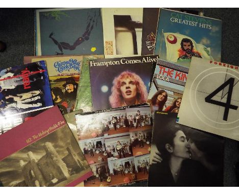 A collection of 33.3 rpm vinyl albums ca 1970's including The Kinks, Rolling Stones, Queen, Bob Dylan, John Lennon, Talking H