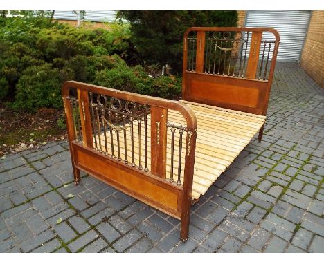 A good quality period double bed, the headboard and footboard with brass slatted decoration - Dimensions are 125 cm width and