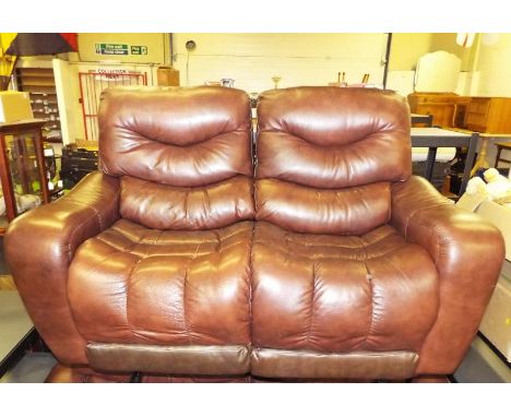 A two seater brown leather manual reclining sofa, approx 93cm x 162cm x 80cm (see also lot 71)