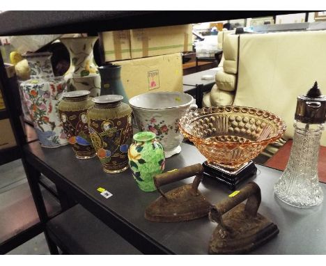 A shelf lot consisting a collection of ceramics to include Oriental vases, floor standing vases, a glass fruit bowl and a sil