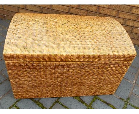 A large dome topped trunk covered in wicker, 51cm (h) x 80cm (w) x 52cm (d)