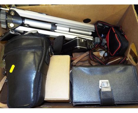 A mixed lot of vintage cameras, tripod and similar