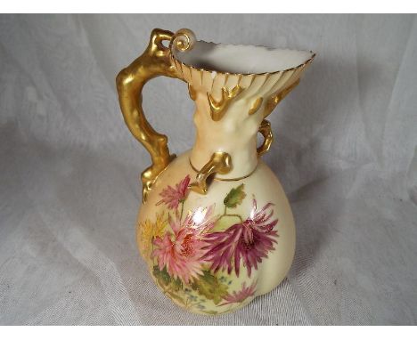 A Royal Worcester blush ivory jug with coral moulded handle, floral decoration with gilded accents, shape no 1507, 16 cm (hig