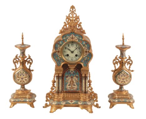 A FRENCH CHAMPLEVÃ‰ AND ORMOLU THREE PIECE CLOCK GARNITURE BY A. D. MOUGIN 19th century, the two train movement striking on a