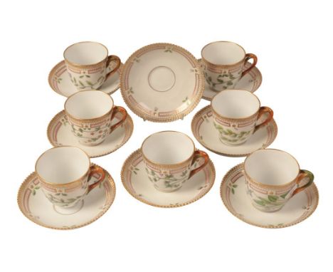 A ROYAL COPENHAGEN PORCELAIN FLORA DANICA PART TEA SERVICE including seven cups, the bodies painted with various flowers, the