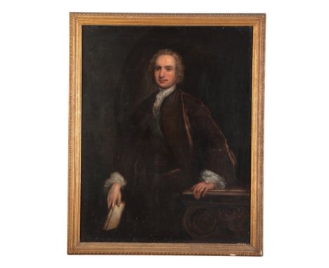 ENGLISH SCHOOL, 18TH CENTURY A portrait of a gentleman depicted three-quarter-length standing in an interior, wearing a brown