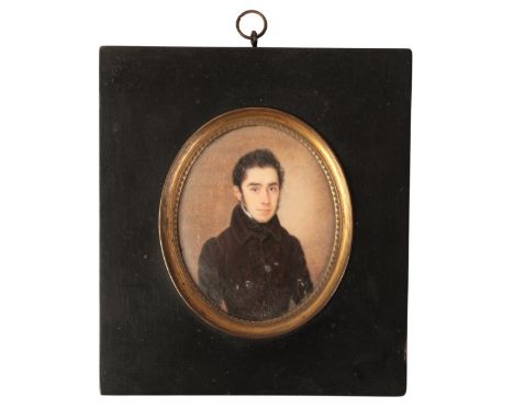 A WILLIAM IV PORTRAIT MINIATURE painted on ivory, a young man in a black coat, inscribed in French verso and dated 1834, 7.6c