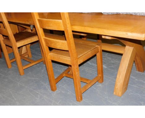 A Parisiene light oak refectory draw leaf dining table, 798cm high, 238cm wide, 288cm extended, 120cm deep, together with fou