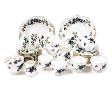 A Wedgwood porcelain part tea service decorated in the Anemone pattern, comprising teapot, pair of graduated cream and milk j