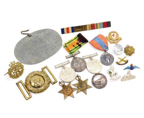 A group of medals, pin badges, etc., to include three 1939-45 Defence Medals, a George VI Faithful Service medal awarded to J