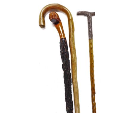 A carved rootwood walking stick, 87cm high, an early 20thC Anglo Indian walking cane, with a white metal handle embossed with