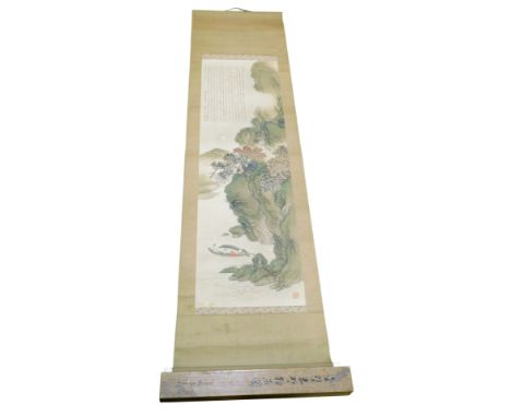 A Japanese Meiji period kakemono or scroll painting, of a river landscape with figures in a boat and lengthy inscription to t