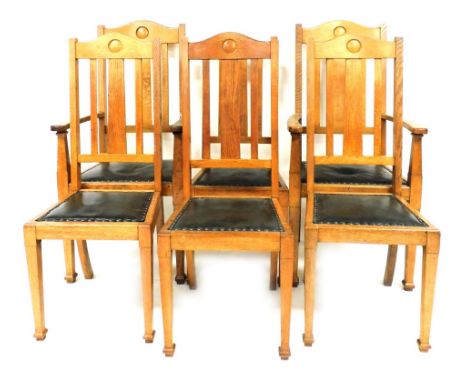 A set of six Victorian oak dining chairs, with button green leather seats, raised on tapering square legs, comprising a pair 