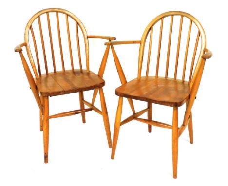 A pair of Ercol utility period light elm and beech Windsor carver chairs, number F182. 