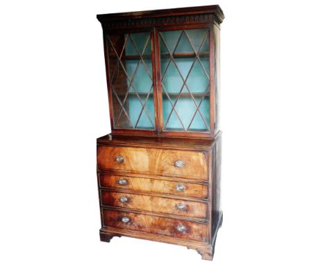 A George III mahogany secretaire bookcase, the outswept pediment with Gothic moulding over four adjustable shelves, above a f