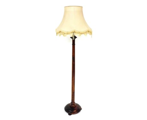 A Victorian stained oak standard lamp, with an oatmeal coloured shade, 187cm high. 