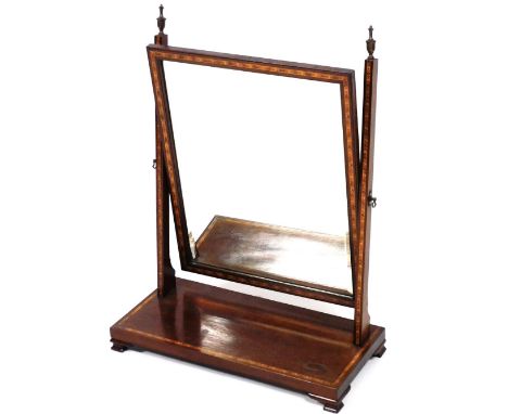 A 20thC mahogany and feather banded dressing table mirror, the rectangular bevel plate on square tapering supports with turne