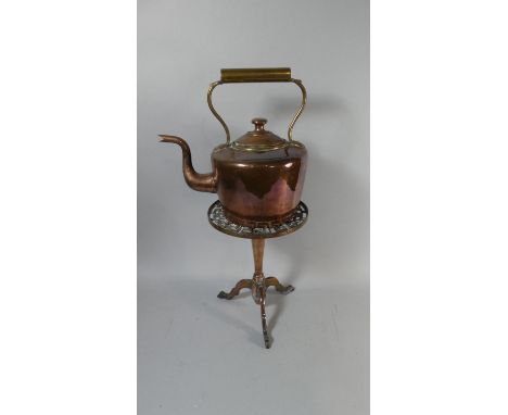 A Heavy Tripod Kettle Stand with Pierced Circular Top Together with a Copper Kettle, 29cm High 