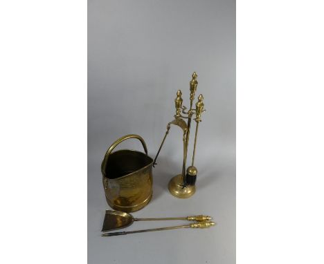 A Brass Helmet Shape Brass Scuttle and Set of Brass Fire Irons 