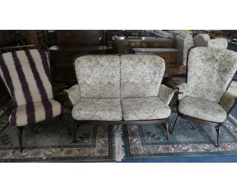 An Ercol Three Piece Suite, One Chair in Need of New Straps 
