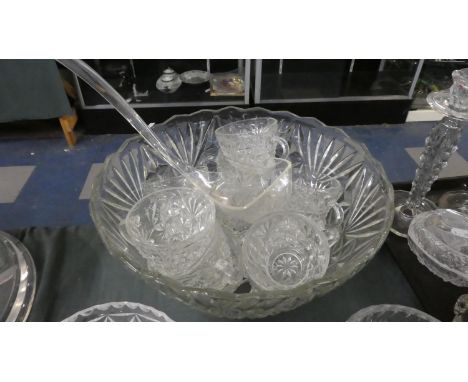 A Moulded Glass Punch Bowl and Glasses Set with Ladle 