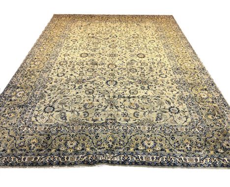 FINE SIGNED KASHAN CARPET, 398cm x 296cm, all over palmette and scrolling vine design on a jade field within complimentary bo