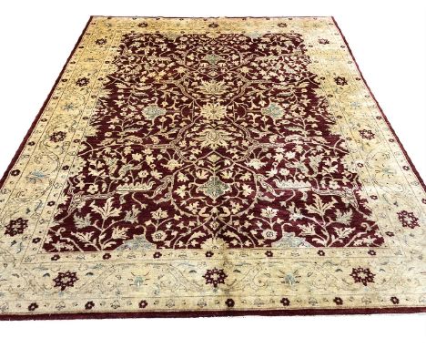 FINE ZEIGLER GAROUS DESIGN CARPET, 295cm x 245cm, all over palmette and scrolling vine design on a ruby field within complime