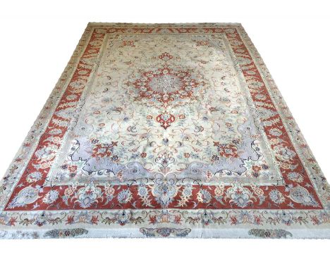 TABRIZ DESIGN CARPET, 365cm x 246cm, part silk pendant medallion on an ivory palmette and vine field within complimentary spa