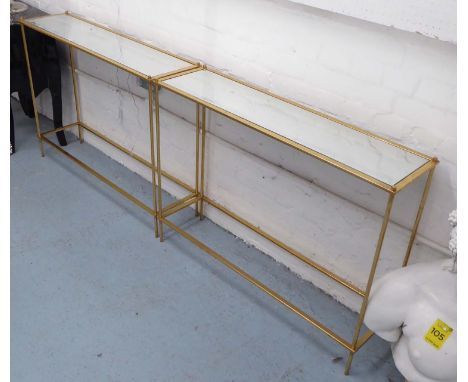 CONSOLE TABLES, a pair, with mirrored tops on gilded metal bases, 102cm x 27cm x 75cm H. (2)