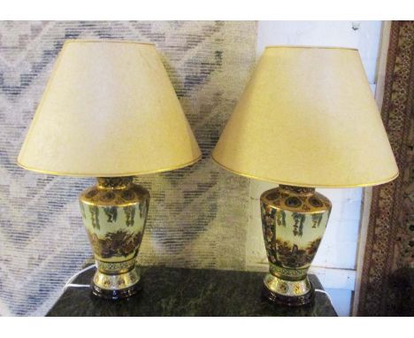 TABLE LAMPS, a pair, ceramic, each with a parchment effect shade and bird and floral decoration, 65cm H. (2) (slight faults)