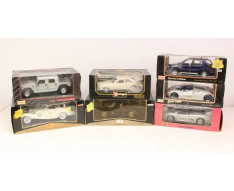 Diecast: A collection of seven 1:18 Maisto / Bburago scale model vehicles. Contents appear generally in very good condition. 