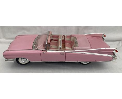 Diecast: An unboxed Maisto 1:12 scale Cadillac Eldorado Barritz. Some display wear, one broken wiper, generally good conditio