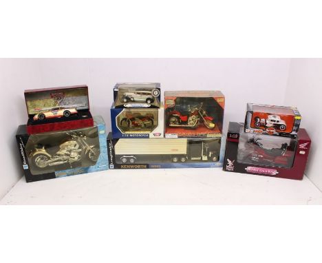 Diecast: A collection of eight assorted boxed scale diecast model vehicles to include: NewRay, Anson, Road Legends, Maisto an