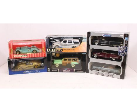 Diecast: A collection of four boxed 1:18 scale diecast models to include: Road Legends, AutoArt, Tonka Polistil, and Jada Toy