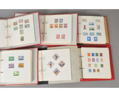 A collection of thirty-three stamp albums, containing mint and used World stamps