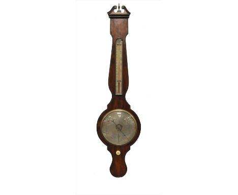 A 19 th century walnut veneered aneroid banjo barometer, with a broken swan neck pediment above a thermometer and 8 inch silv