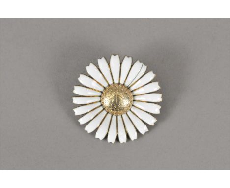 A Georg Jensen silver and white enamel daisy brooch, the silver gilt centre within a surround of white enamel petals, 50mm di