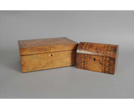 A Victorian burr walnut veneered tea caddy, of domed form, inlaid with parquetry borders, the hinged cover opening to reveal 