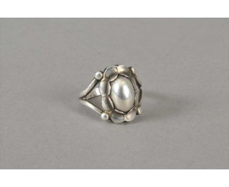 A Georg Jensen silver ring, design No. 24, the oval boss centre within 'foliate' surround, ring size Q 1/2, weight approx 5.4