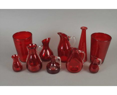 A good collection of Whitefriars ruby glass mid-20th century including a duck, bowl, assorted jugs, pair of tapered bucket 'w