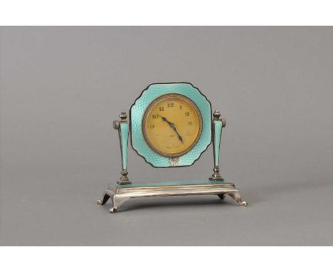 A small silver and guilloche enamel cased bedside clock, with Arabic numerals and second markers, stamped Sterling silver to 