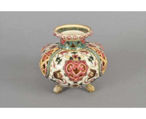 A Zsolnay Pecs vase circa 1885 of double-walled construction with reticulated outer body, enamelled with flowers against a cr