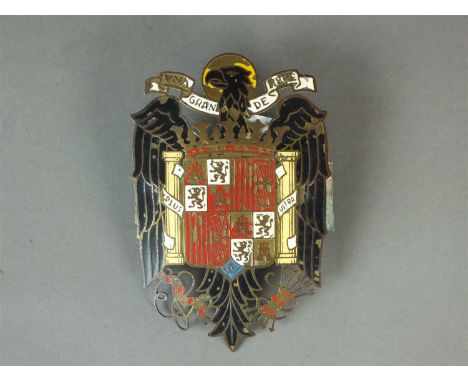 A Spanish enamel on copper car badge with the Coat of Arms of Spain, circa 1965-70, 11.5cm high x 7.5cm wide