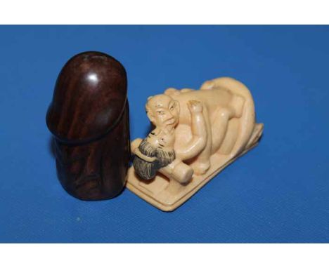 EROTIC CARVED WOODEN NETSUKEalong with a carved ivory netsuke depicting an amorous couple and and pill box (3)