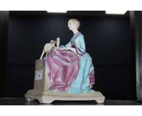 GOLDSCHEIDER MUSICAL FIGURINE FOR SINGER MFG. COdepicted a women seated at sewing machine, document below machine reads "Sing