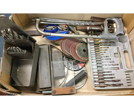 A box containing metalwork tools.