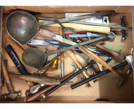 A box containing hammers and other tools.