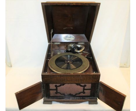 "The Dolceola" table top oak cabinet gramophone with two front cabinet doors concealing a speaker, 33cm high x 46cm long.